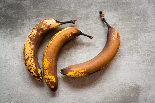 Brown Bananas On A Concrete Table