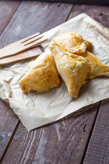 Traditional Russian Cabbage Stuffed Baked Pastry on Rustic Table, Vertical View