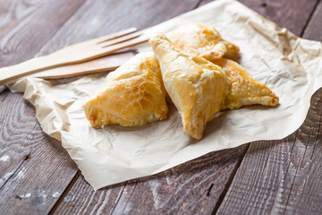 Homemade Pies called Pierogi with Meat and Cabbage on the Wooden Table