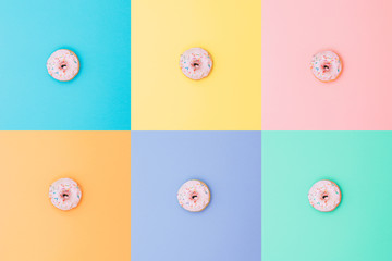 six identical pink doughnuts on different backgrounds in the style of pop art  and minimalism.