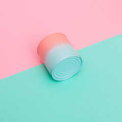 pink and blue can of soup with dip-dyed on mint and pink background. minimal fashion trend of food