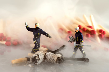 Fire fighters at work in dense smoke - miniature models