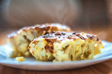 Freshly baked milk homemade pie with eggs and cheese.