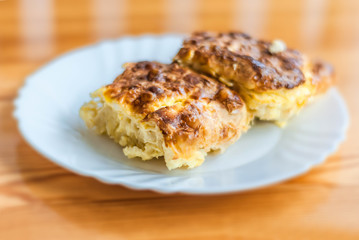 Freshly baked milk homemade pie with eggs and cheese.