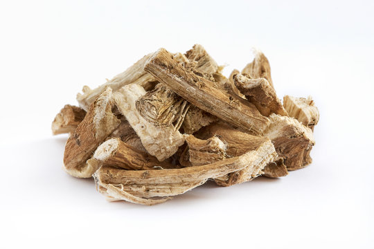 Fototapeta Pile of dried and sliced marshmallow root (Althaea officinalis) isolated on white background