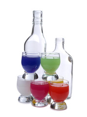 Cocktail in a glass and bottles on white background