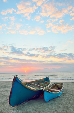 Blue boats on beach