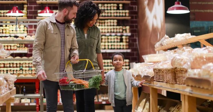 Family buying bread in grocery store