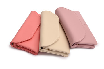 Three leather clutch isolated on white
