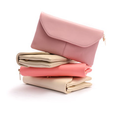 stack of leather clutch isolated on white
