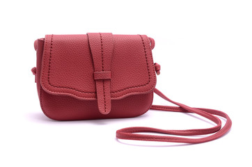 Red leather clutch isolated on white