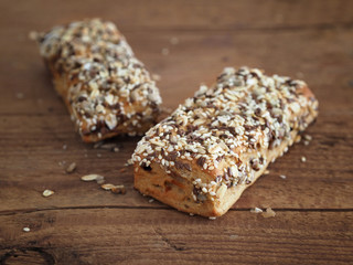 Cereal bars on wooden background
