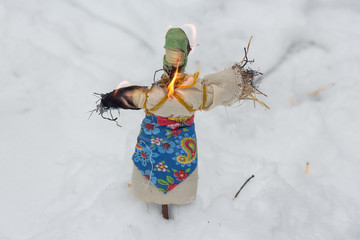 burning effigies of Carnival/ The ritual burning of effigies of Carnival in the Russia expresses...