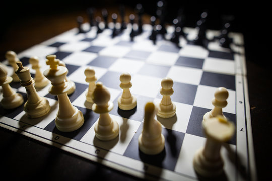 White and black pieces on chess board