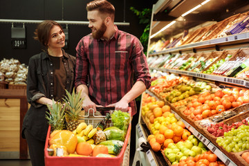 Happy loving couple in supermarket