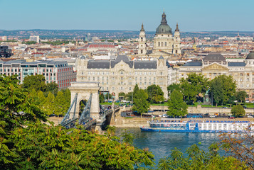 Fototapeta na wymiar View of Chain Bridge, Gresham Palace, St Stephen Basilica and the Danube River from the Castle Hill of Budapest