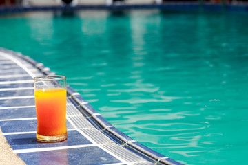 Orange Juice Near Water Pool