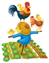 Scarecrow and chickens in vegetable garden