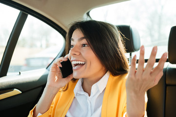 Close up portrait of a young female executive on phone