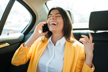 Close up portrait of a young female executive on phone