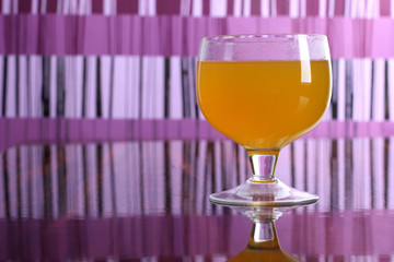 Cocktail in a glass on a colored background