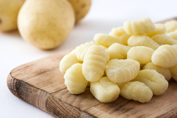 Uncooked potato gnocchi isolated on white background
