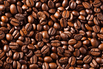 Background from the fried coffee grains macro texture
