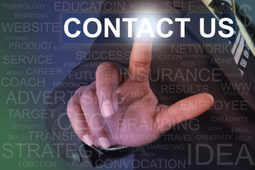 Businessman touching contact us button on virtual screen