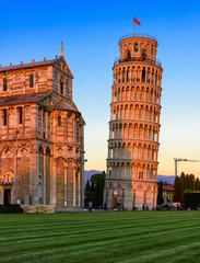 Sunset view of Pisa Cathedral (Duomo di Pisa) with the Leaning Tower of Pisa (Torre di Pisa) on Piazza dei Miracoli in Pisa, Tuscany, Italy