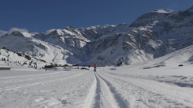 Fit woman crosscountry skiing on highlands