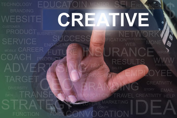 Businessman touching creative button on virtual screen