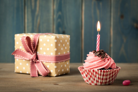 Homemade Birthday cupcake with candle and gift box