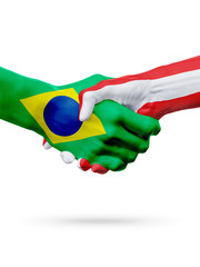 Flags Brazil, Austria countries, partnership friendship handshake concept.