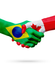 Flags Brazil, Canada countries, partnership friendship handshake concept.