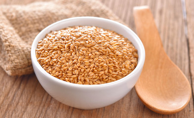 flax seeds heap in bowl on a tabel