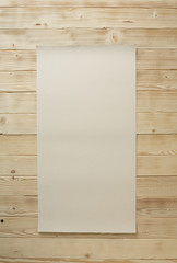 Wooden picnic table with white napkin on