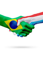 Flags Brazil, Luxembourg countries, partnership friendship handshake concept.
