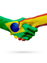 Flags Brazil, Spain countries, partnership friendship handshake concept.