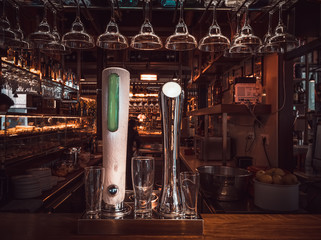 Bar with taps and glasses