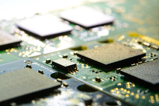 Close up Image of Electronic Circuit Board with Processors in Bright Light. Computer Technology Concept Background