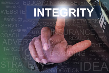 Businessman touching integrity button on virtual screen