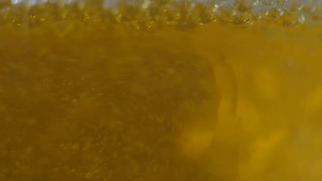 Closeup of beer glass in slow motion