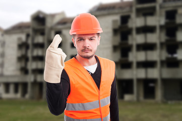 Construction worker doing luck sign