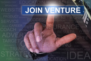 Businessman touching join venture button on virtual screen