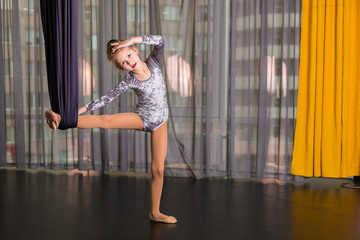 Little dancer in a aerial yoga hammock