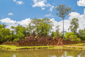 Fototapeta na wymiar Ancient ruins of small beautiful Banteay Srei Temple.