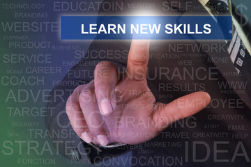 Businessman touching learn new skills button on virtual screen