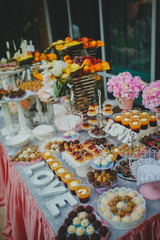 Beautiful sweets on buffet table with decorations