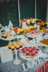 Beautiful sweets on buffet table with decorations