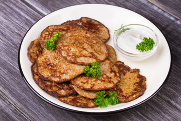 Liver Patties with Sour Cream and Parsley. Liver Cakes or Fritters of Liver. Healthy snack or take-away lunch bites.